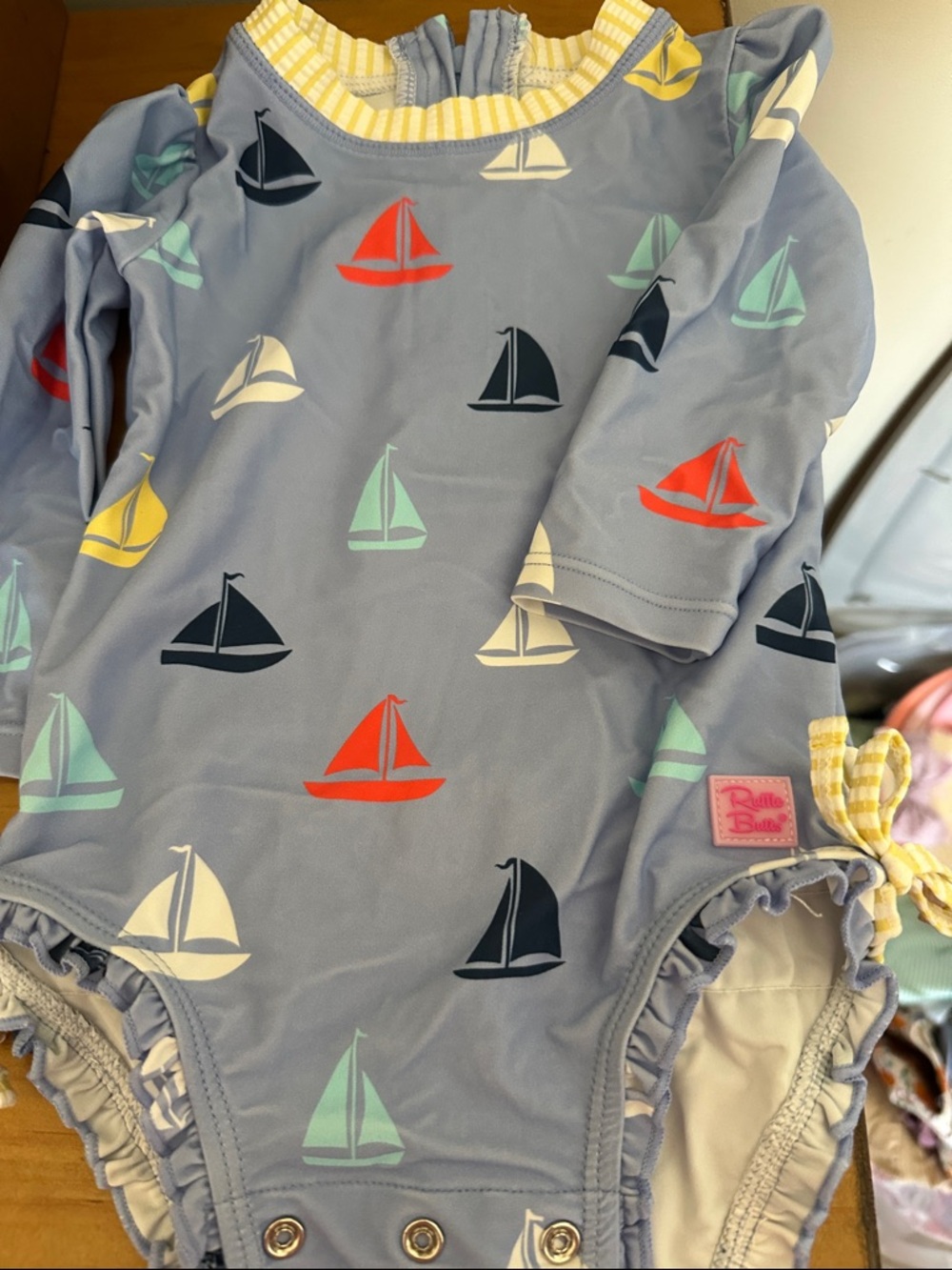 Ruffle Butts Sailboat Long-Sleeve One-Piece in Light Blue with Multicolor Boats